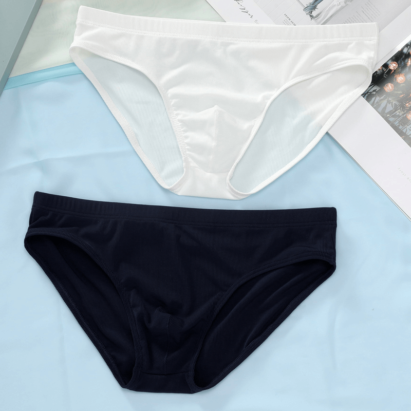 Thin Breathable Ribbed Briefs for Men in white and navy blue, showcasing low-rise waist design, perfect for casual comfort.
